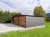 garaz-blaszany-z-wiata-9x6m-matowa-czern-dab-rustykalny-furtka-9.jpg